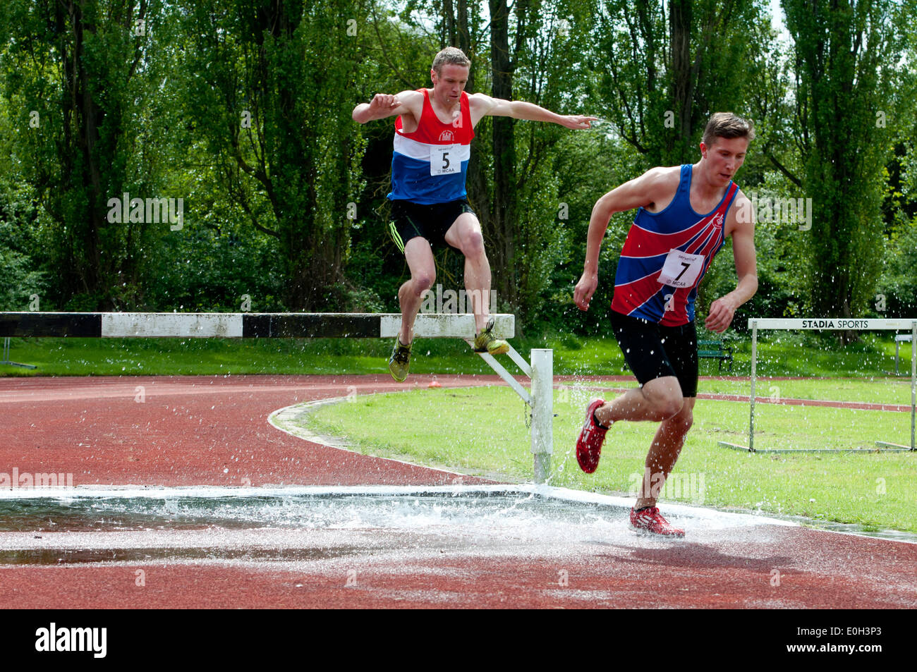 Athletics, men`s steeplechase at club level, UK Stock Photo Alamy